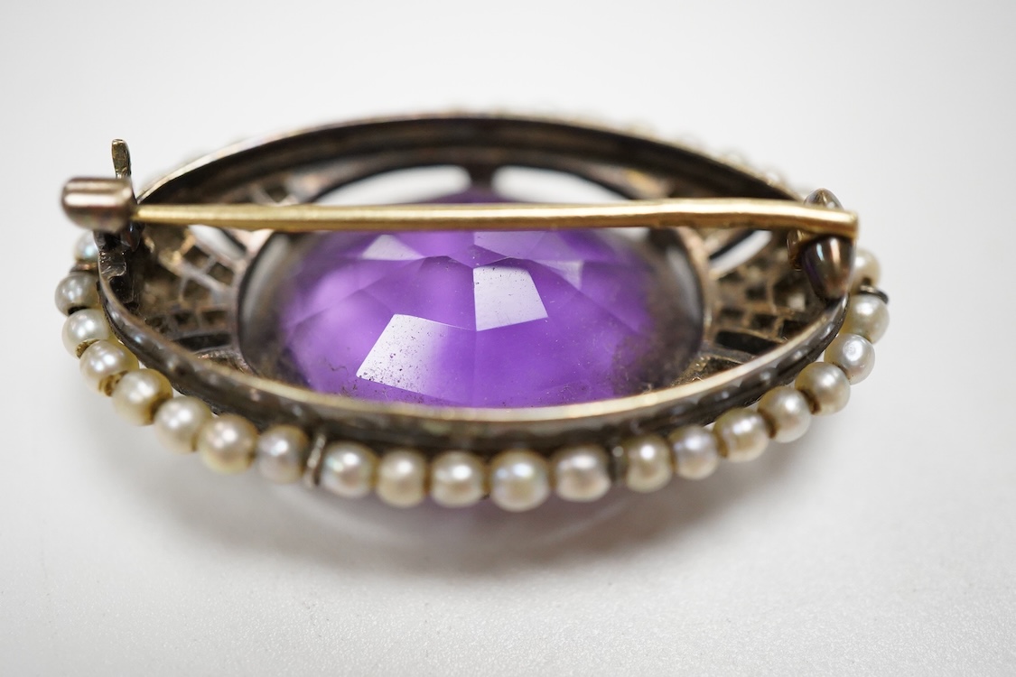 An early 20th century Austro-Hungarian 14k, amethyst, diamond and seed pearl set oval brooch, 37mm, gross weight 10 grams.